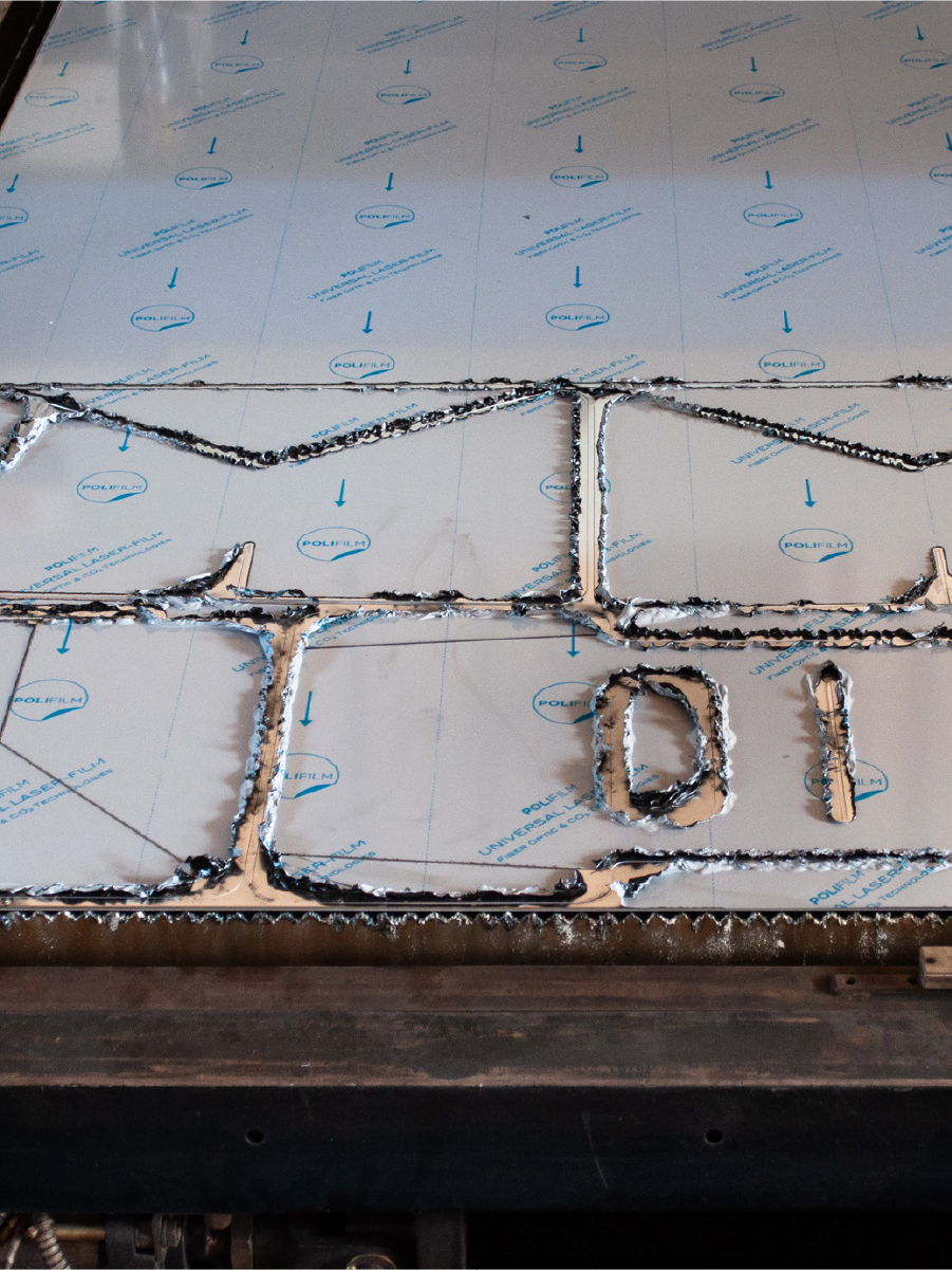 Aluminum sheet with cut shapes